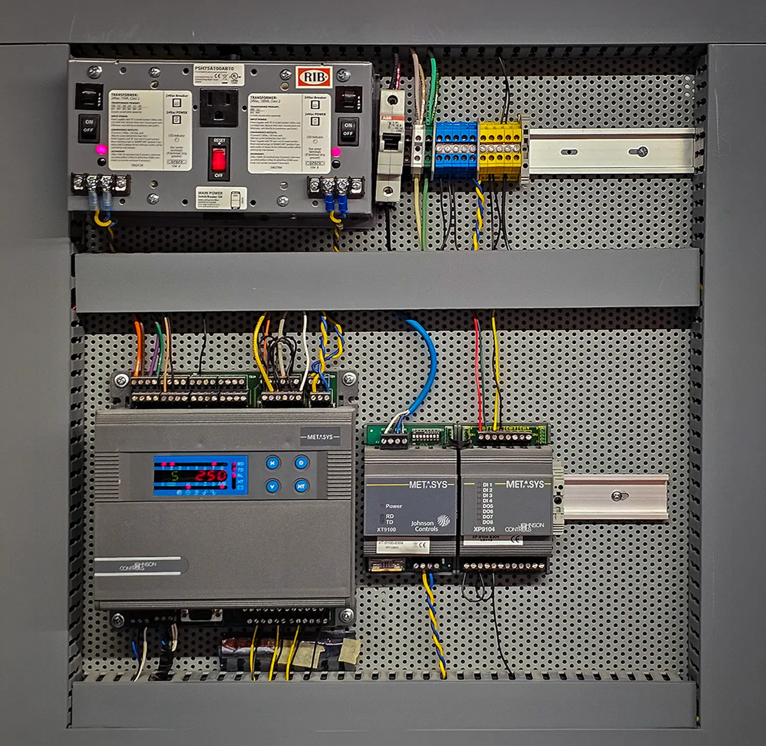 Zion Engineering technician verifying sensors, controller commands, sequence logic, and mechanical equipment response in a building automation system