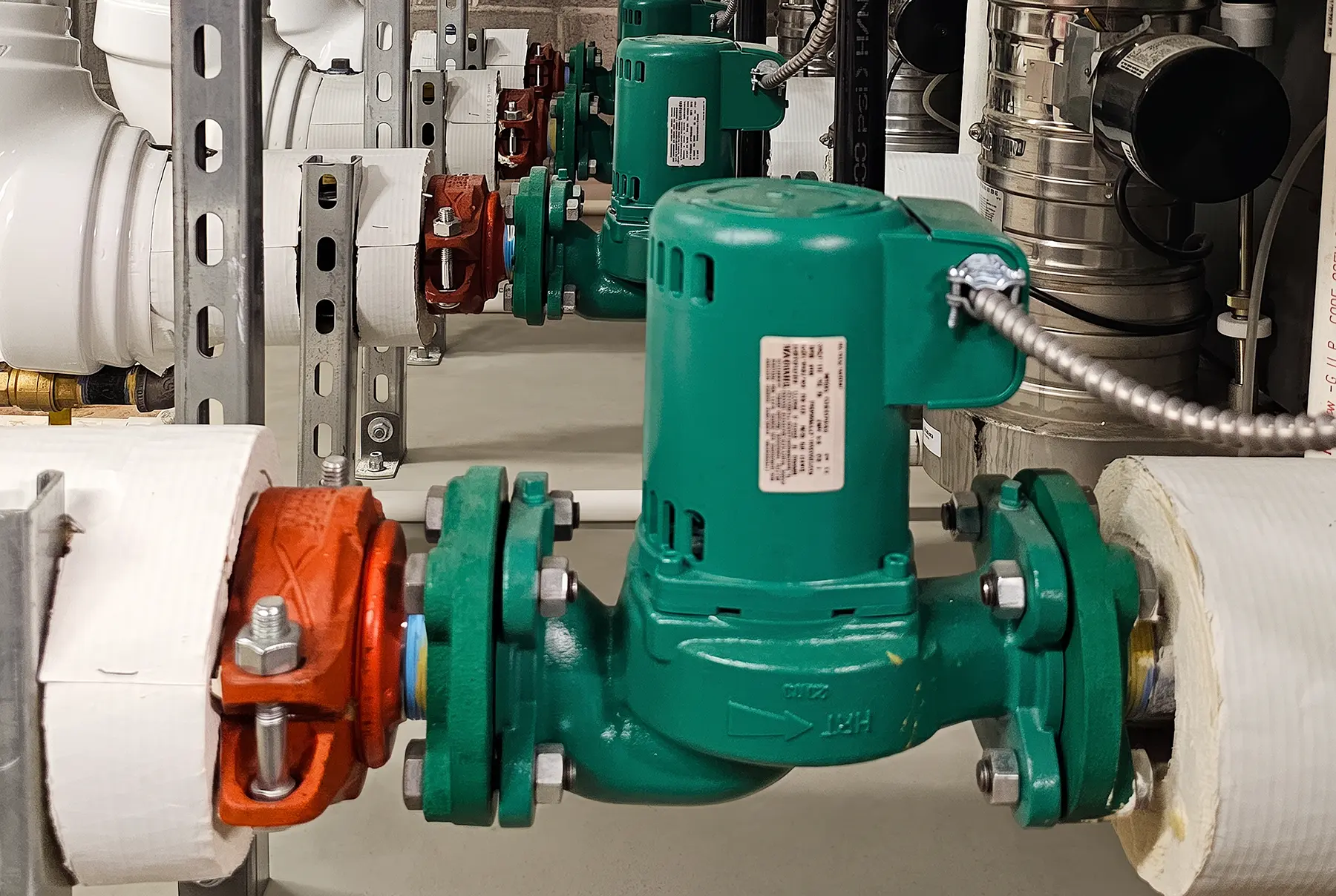Zion Engineering crew coordinating the installation of commercial chiller equipment at an operating building.