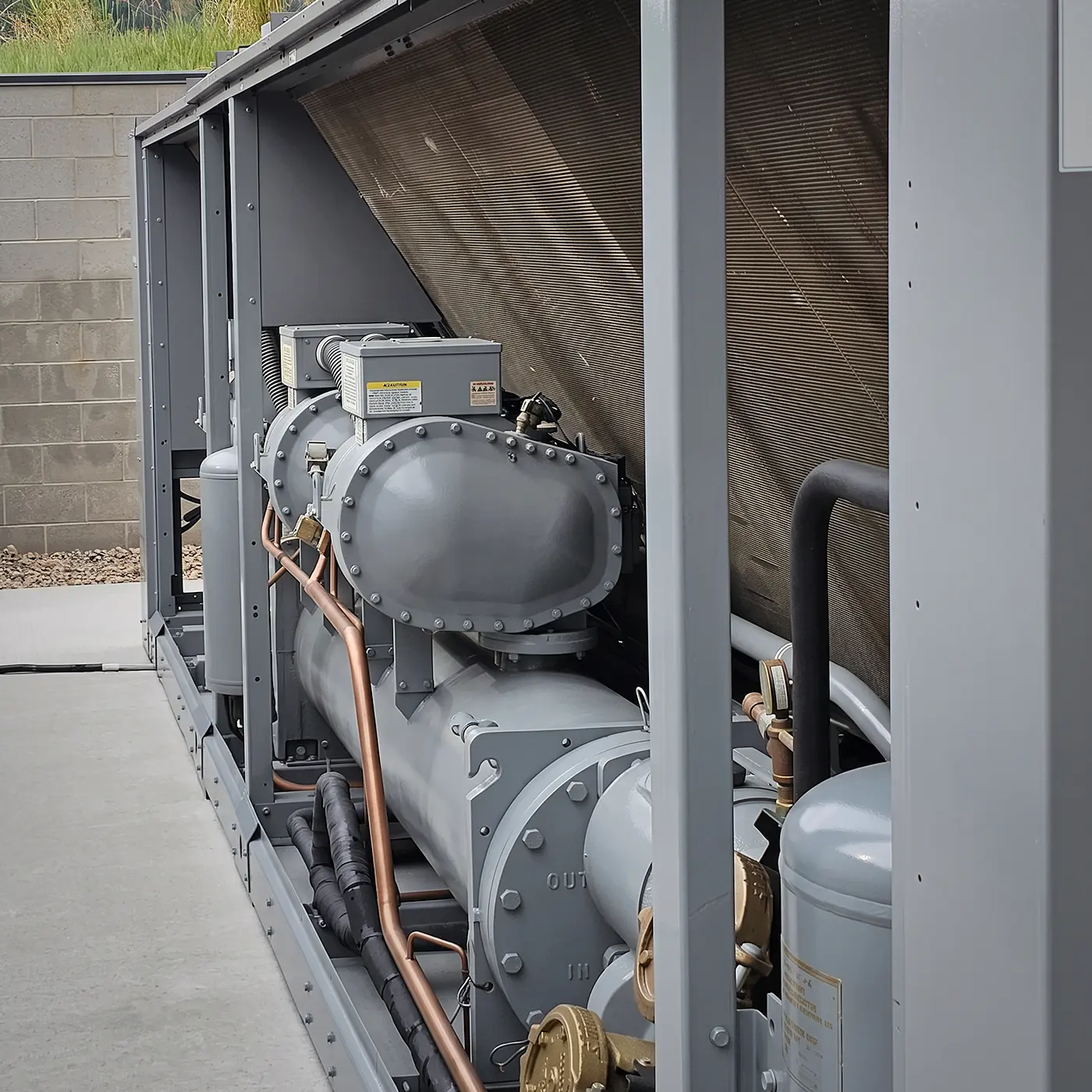 Zion Engineering technician checking chiller, pump, valve, water-flow, and heat-rejection conditions during commercial chiller service