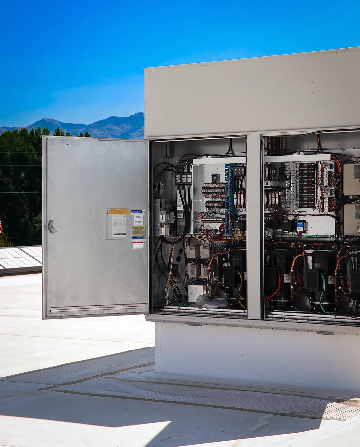 Zion Engineering technician measuring commercial chiller and chilled-water conditions to diagnose a building cooling problem