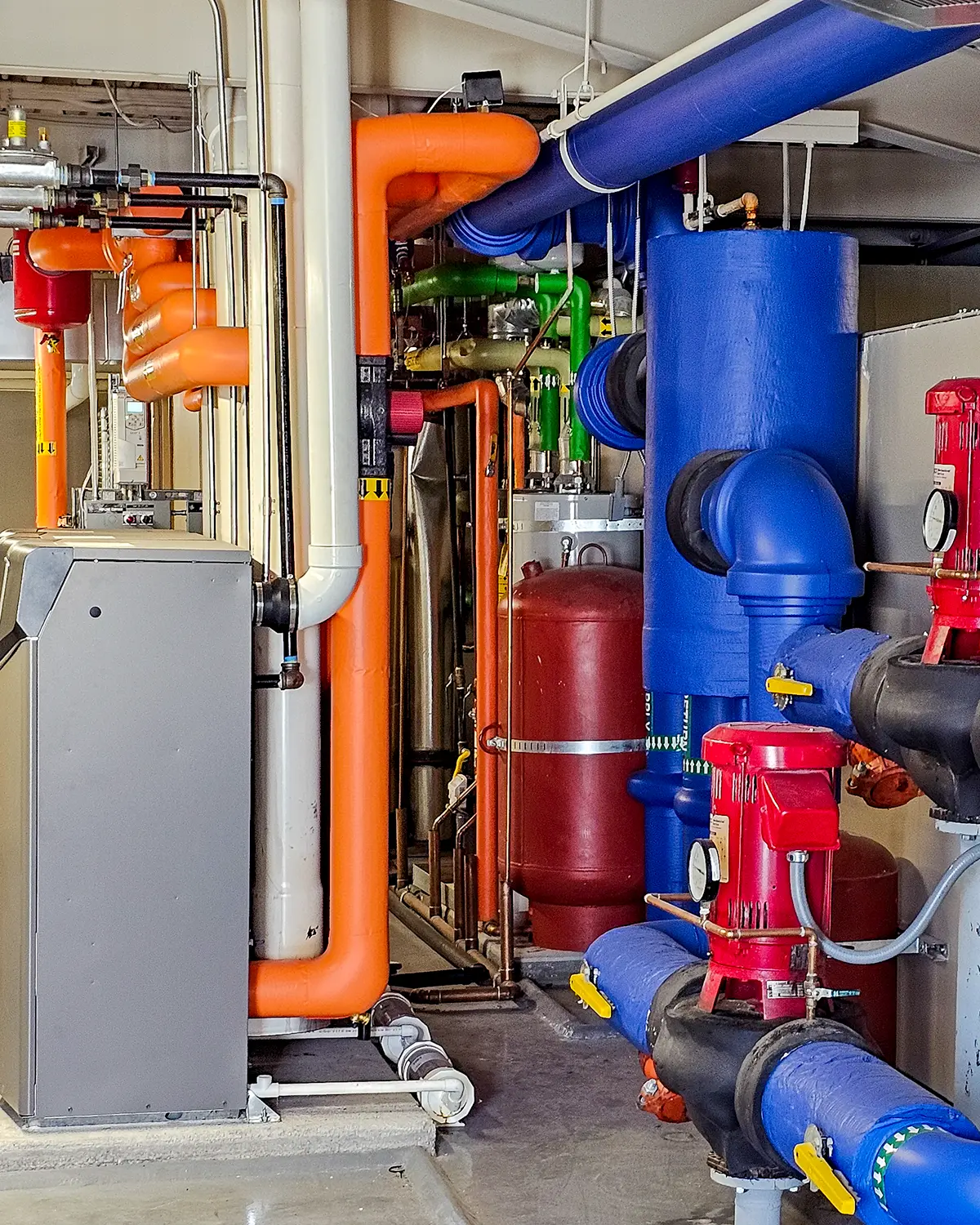 Zion Engineering technician measuring commercial HVAC operating conditions to diagnose a reported building problem