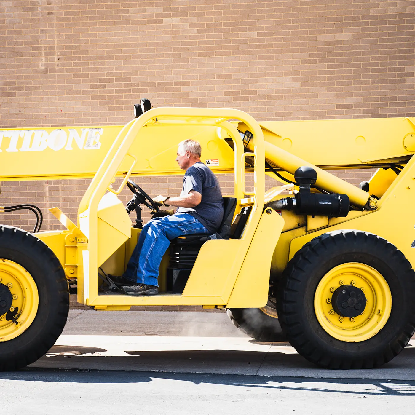 Zion Engineering technician verifying high-pressure commercial HVAC equipment, piping, and system connections