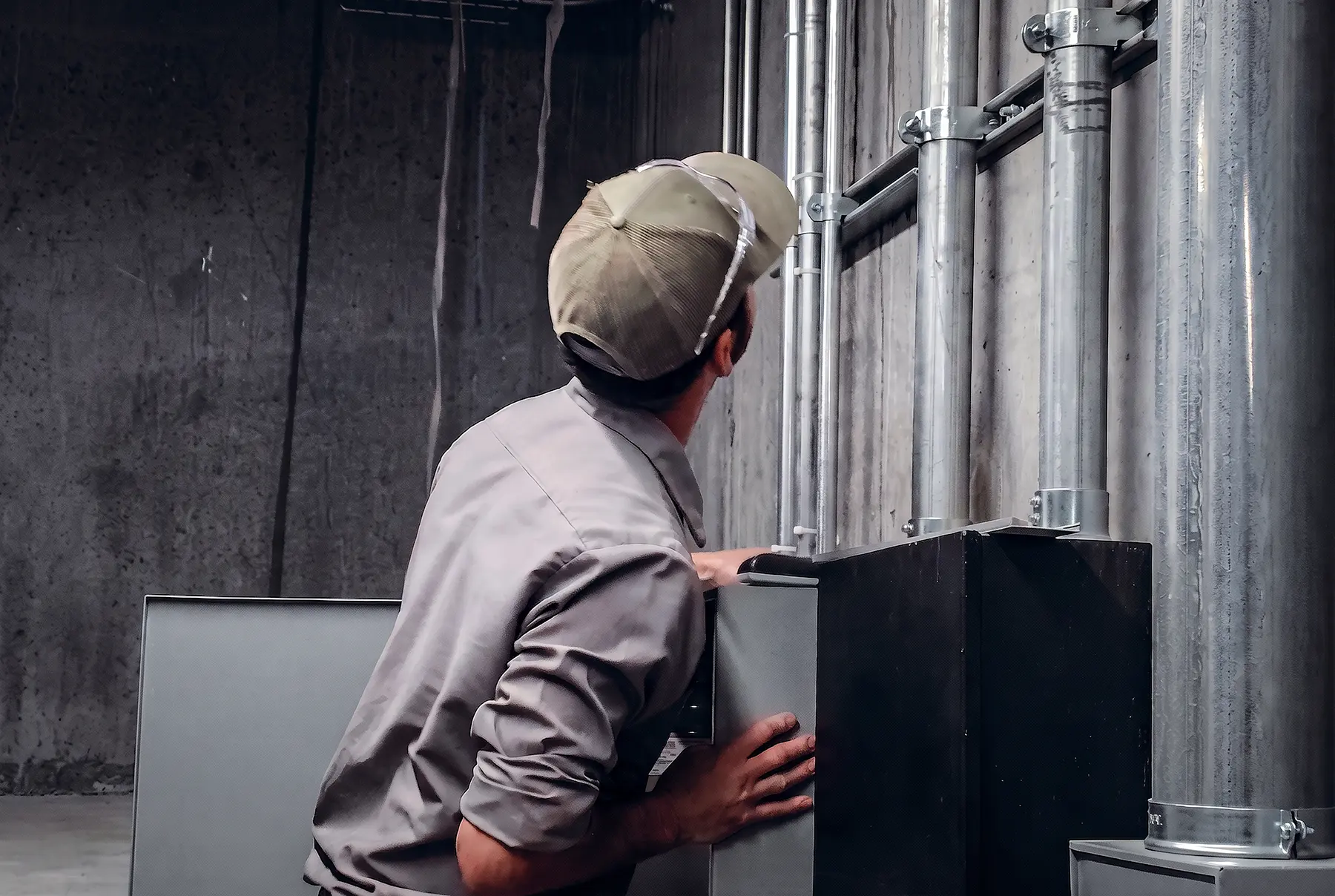 Zion Engineering technician documenting commercial HVAC maintenance findings and repair priorities for a facility team