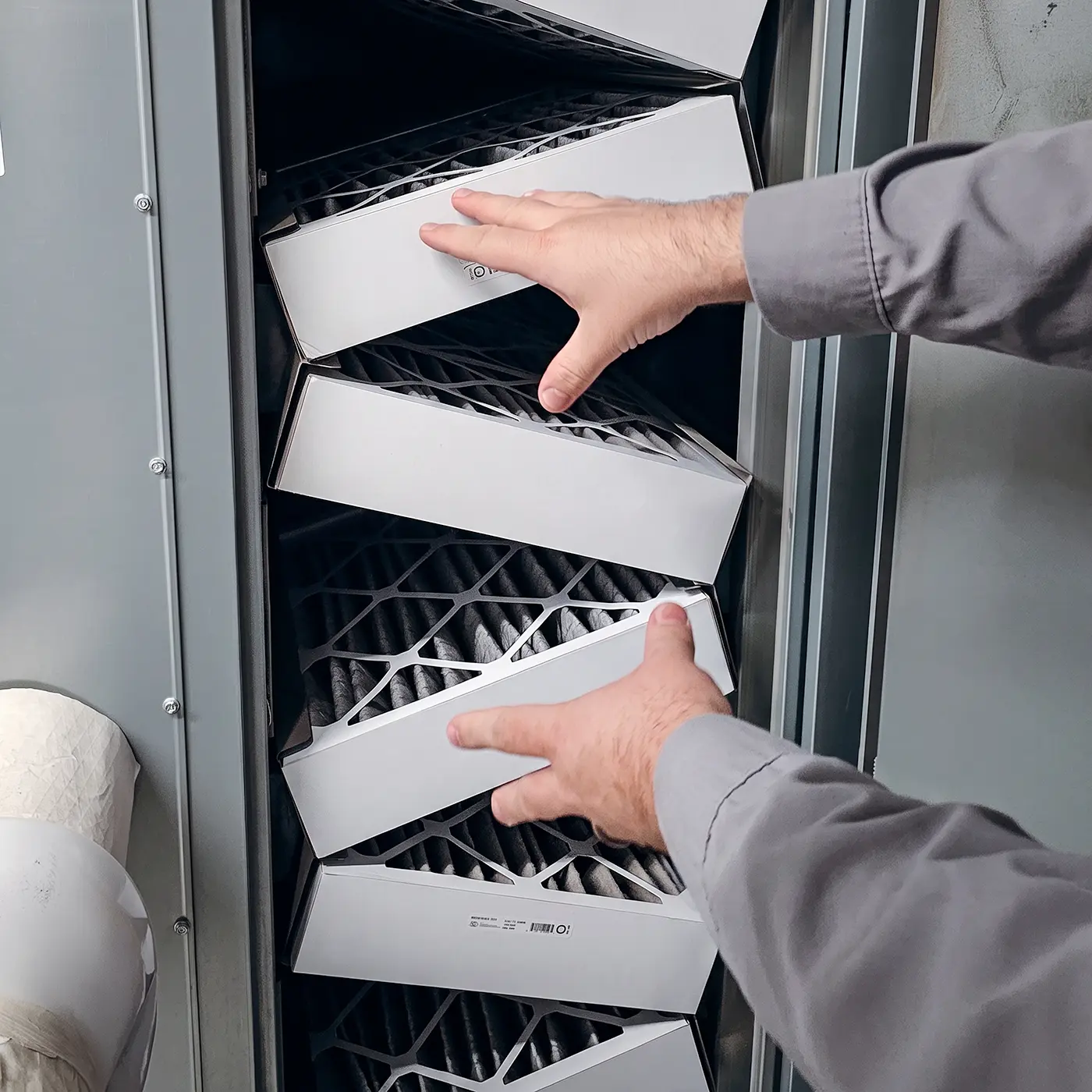 Zion Engineering technician checking temperatures, pressures, airflow, and equipment condition during commercial HVAC preventative maintenance