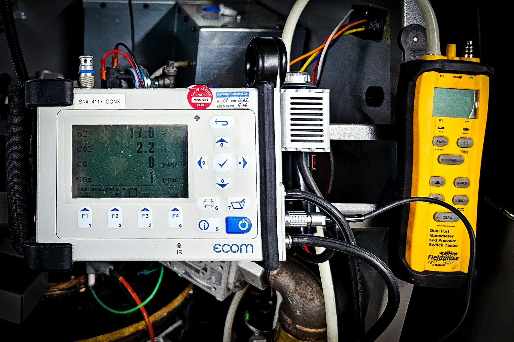 Zion Engineering technician verifying commercial HVAC operation and documenting repair findings for a facility team
