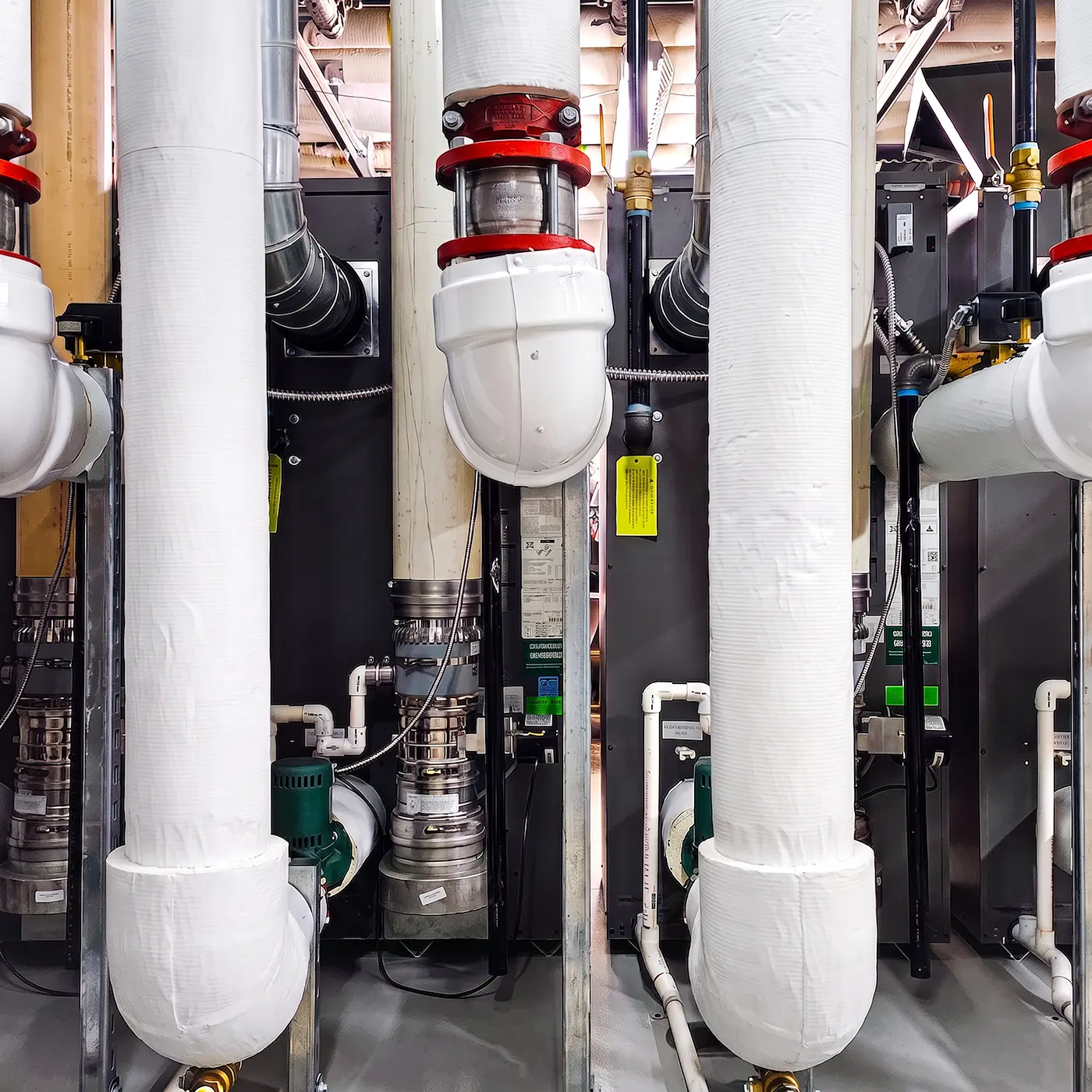 Zion Engineering technician checking commercial mechanical equipment, piping, airflow, and system operating conditions