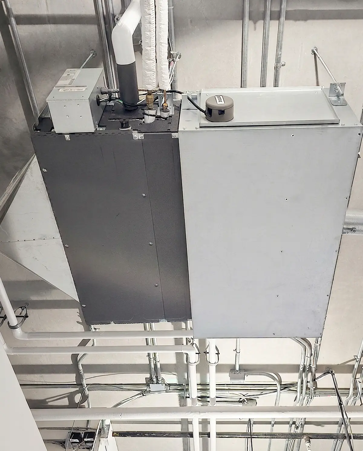 Ceiling-mounted commercial VRF equipment with connected piping and building services reviewed during system diagnostics.